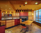 Meticulous custom designed maple and anigre hardwood cabinetry are found throughout.