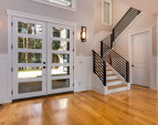 Gleaming oak wide plank wood floors throughout the entire home in all but the three carpeted upstairs rooms.