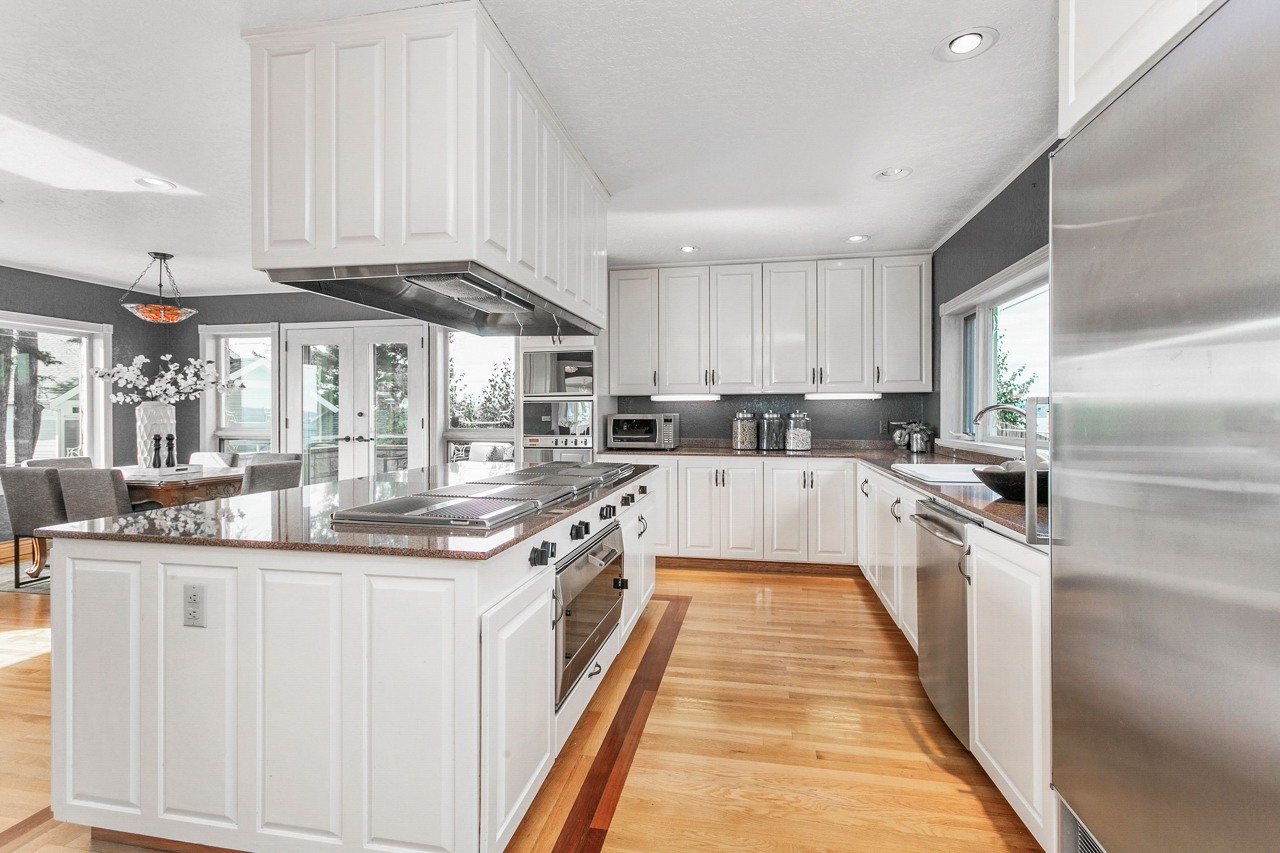 Spacious chef's kitchen was designed for entertaining. Full size Sub Zero refrigerator and matching full size Sub Zero freezer, lots of counter space, two sinks, large pantry and storage galore.