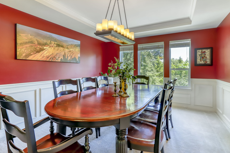 Dining area with wainscot and tray ceiling is very spacious to enjoy many special gatherings.