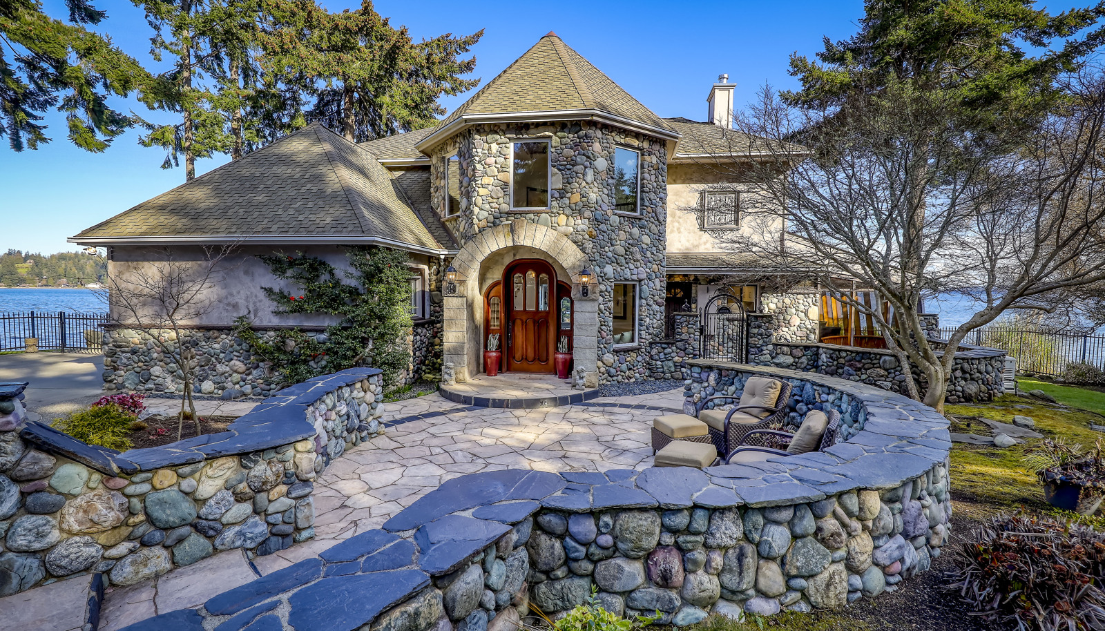 Exquisite real river rock and natural stone walls, patios, pathways, and siding.