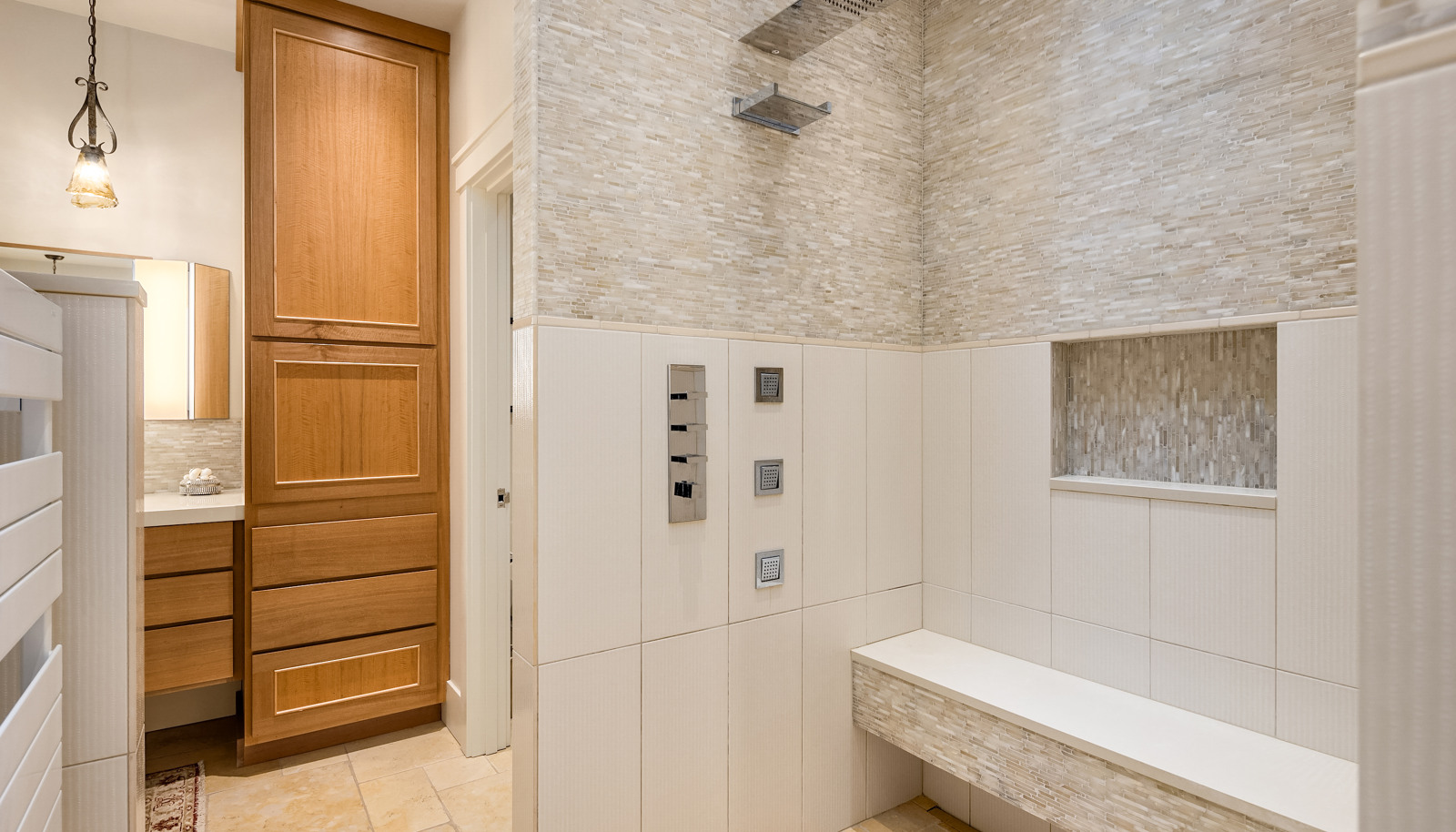 The tiled, walk-in shower. The suite offers an enormous walk-in closet with built-ins, a purse closet and shoe closet, all with cedar lining accents. 
