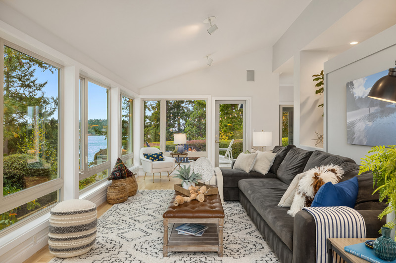 The living room has a beautiful view of Rich Passage and overlooks the gardens. Vaulted ceilings, maple floors and a French door to the deck outside.