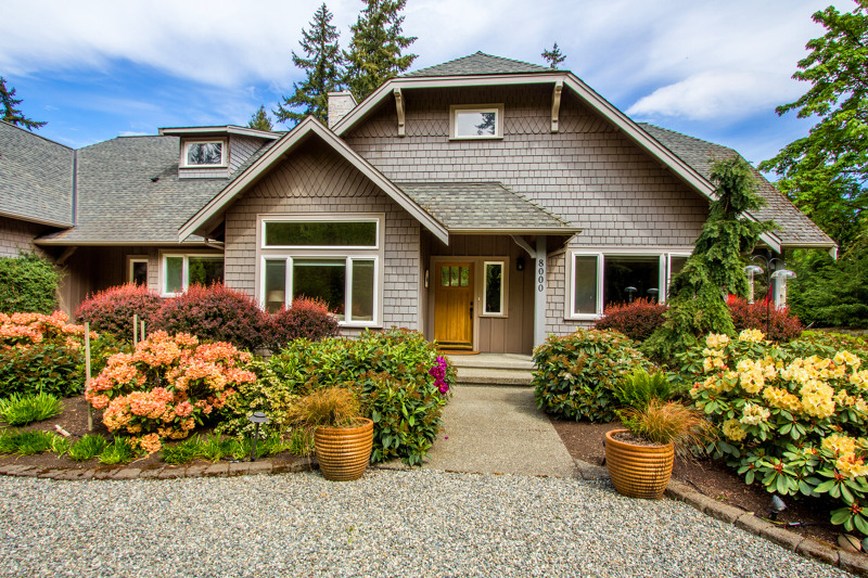 Professionally landscaped with color throughout every season, the entry way draws you in with rich vibrant plantings.