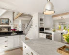 9' Carrara marble island is the centerpiece of the kitchen.
