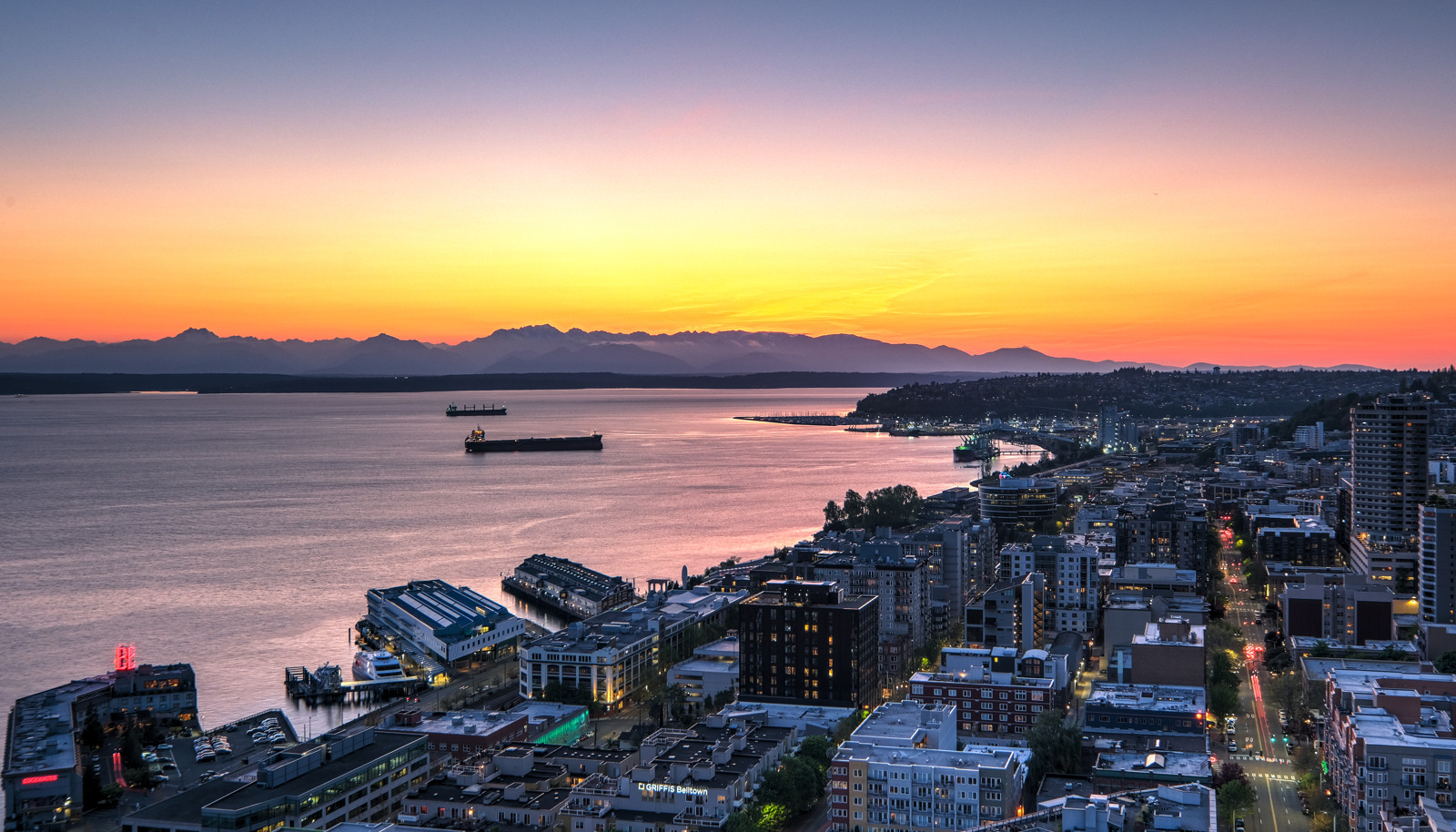 The penthouse offers sweeping unobstructed views of Puget Sound and the Olympic Mountains.