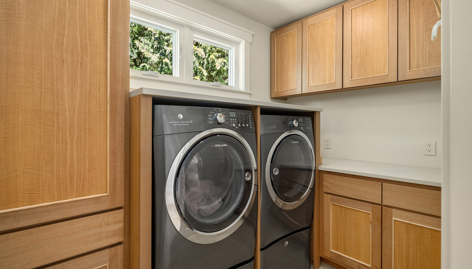 The Primary Suite also boasts its own laundry room with built-ins and a sink. 