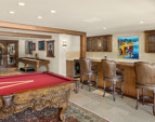 The Media/ Recreation room has a shuffle board, a 900 bottle wine cellar and a propane fireplace. 