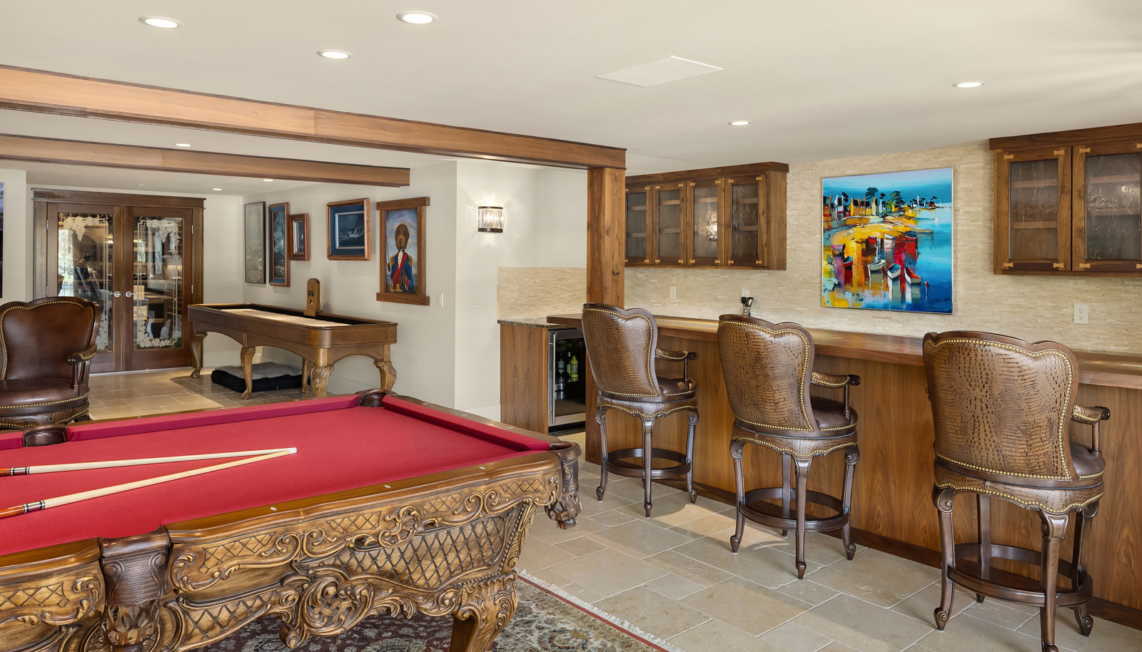 The Media/ Recreation room has a shuffle board, a 900 bottle wine cellar and a propane fireplace. 