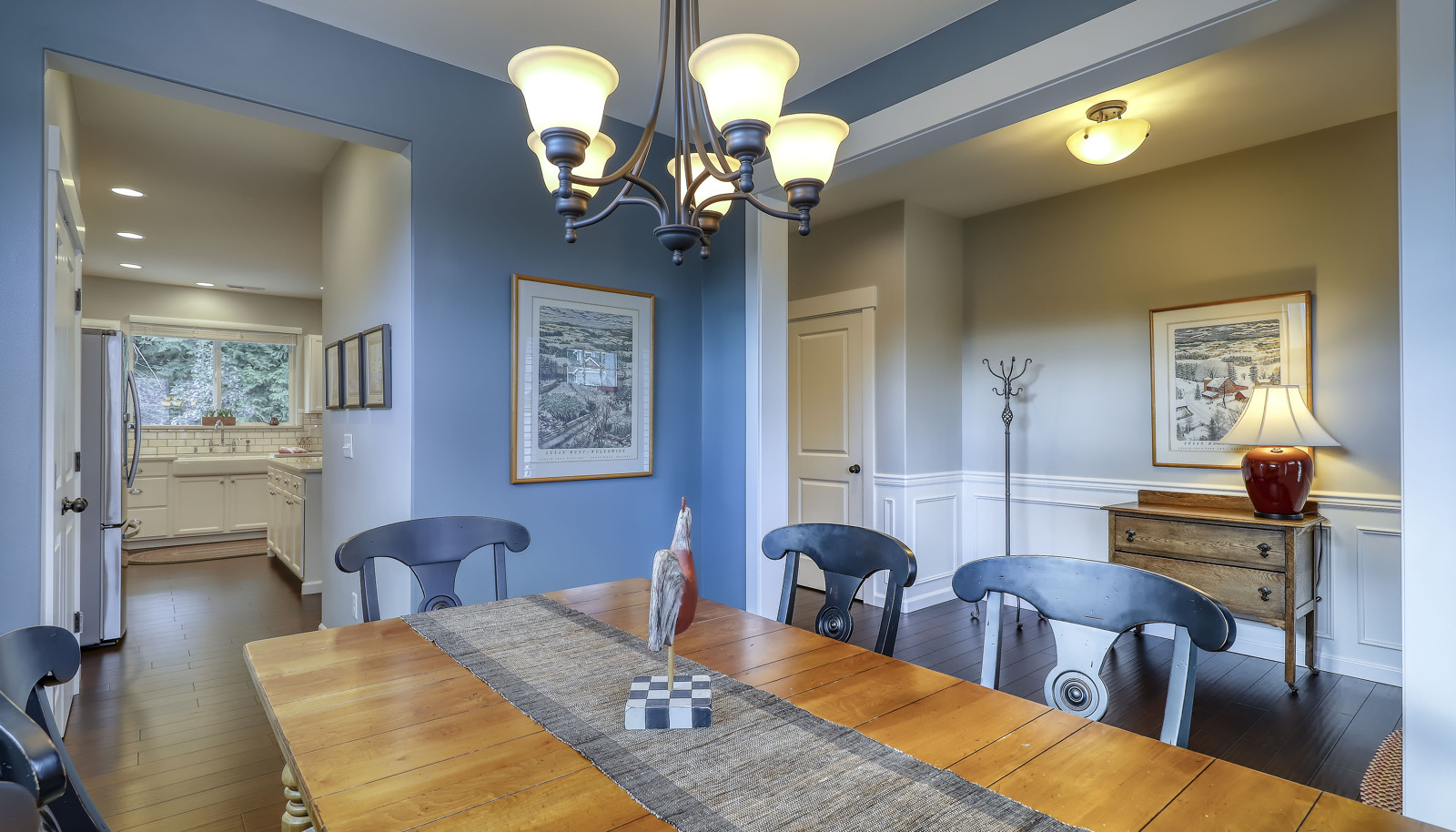 Formal dining room with easy access to the Chef's gourmet updated kitchen!
