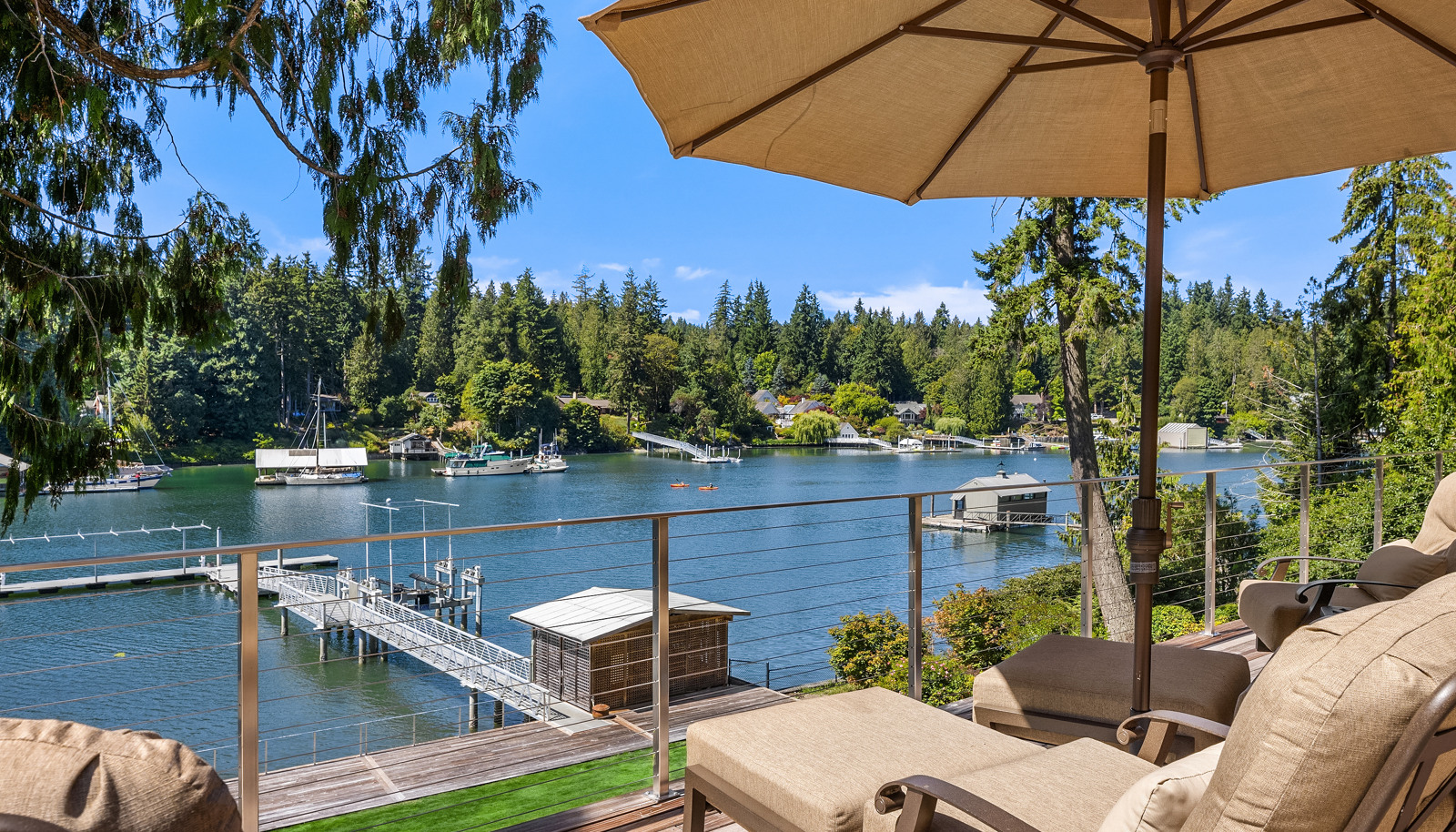 Quality, imaginative, floating Ipe decks, a propane fire-pit, and direct access to the expansive lawn, gardens, shoreside deck and dock. 